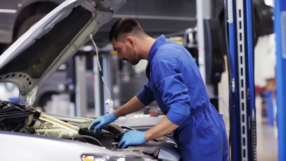 Honda technician working on a car